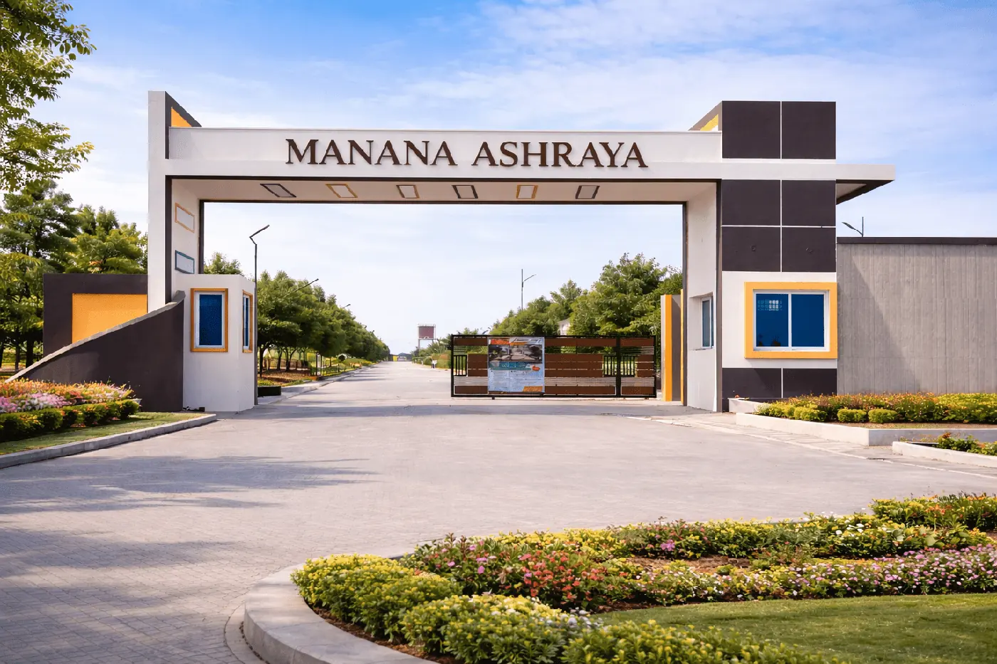 Manana Ashraya entrance gate and landscaped driveway